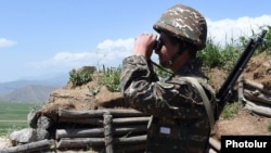 Armenia - An Armenian soldier stands guard on the border with Azerbaijan's Nakhichevan exclave, 14 May 2016.
